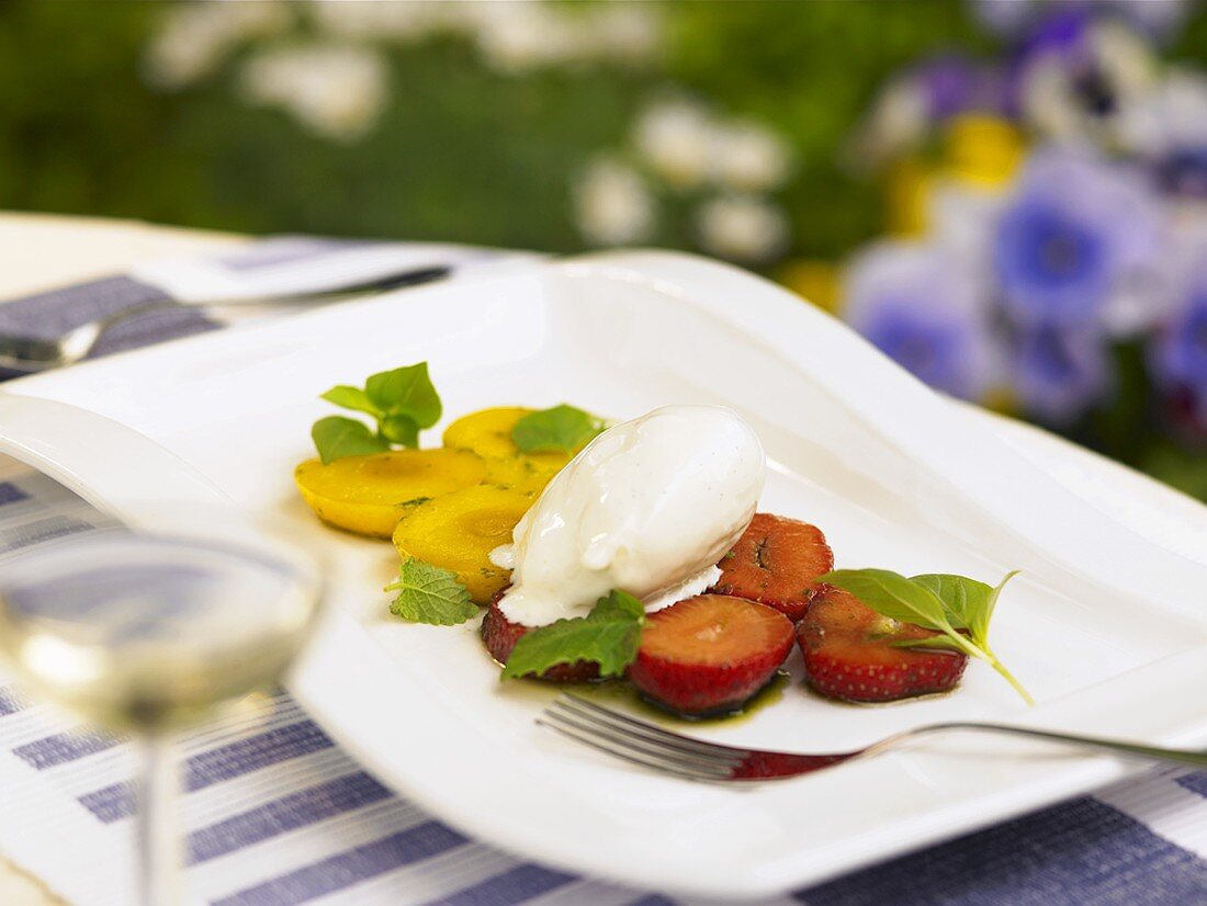 Vanilla ice cream on strawberries & apricots with balsamic vinegar