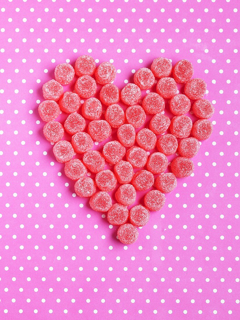Sour fruit jelly sweets forming a heart