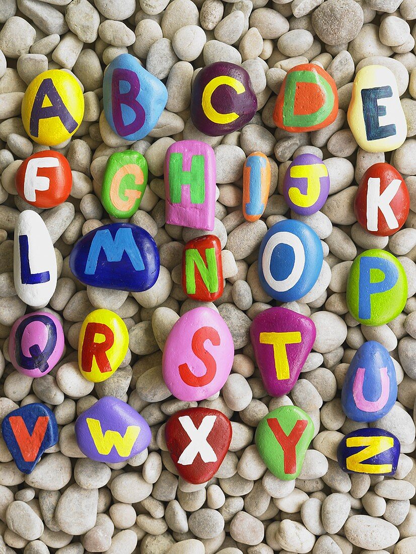 Alphabet painted on pebbles