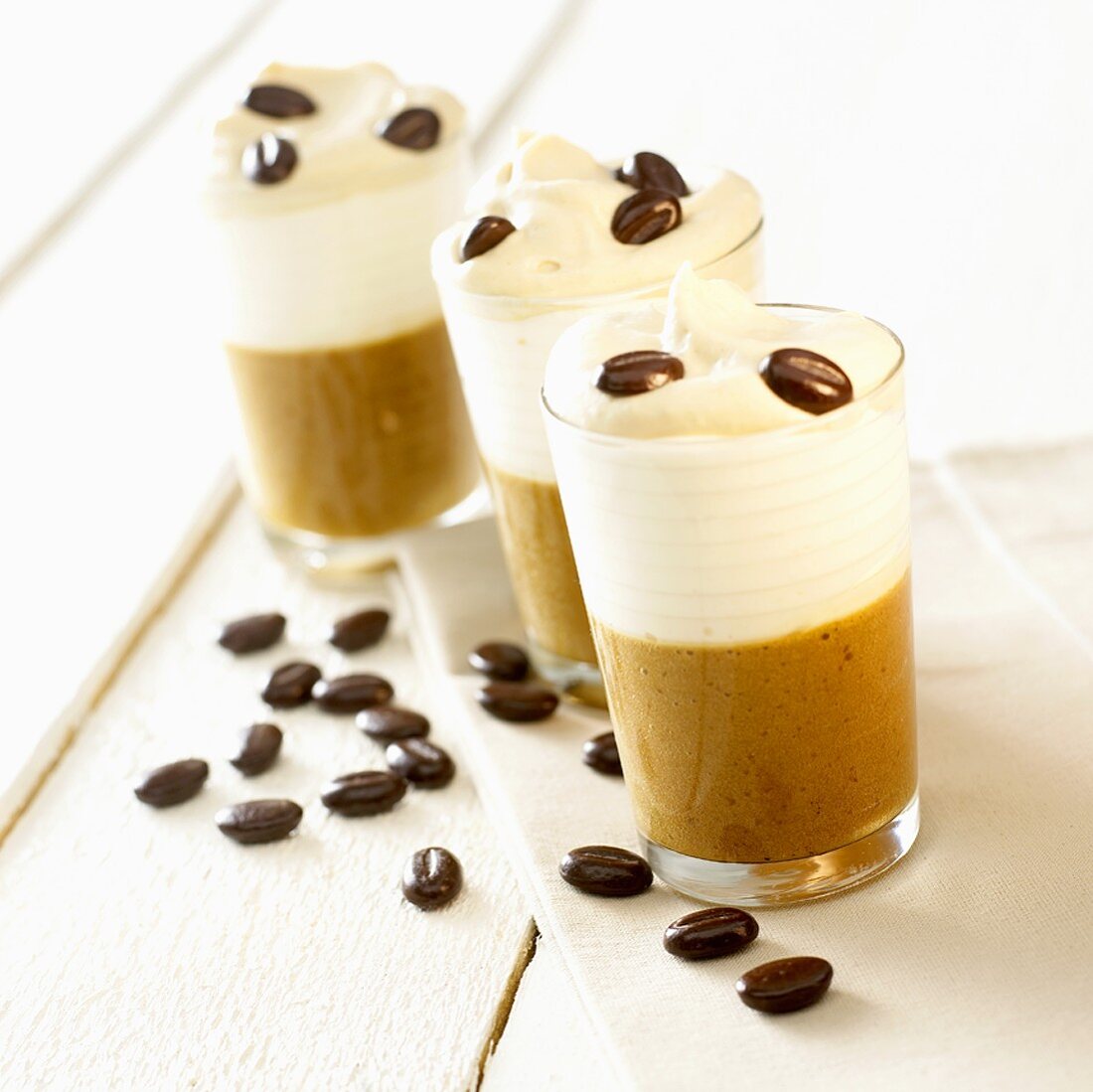 Coffee cream with cream topping in three glasses