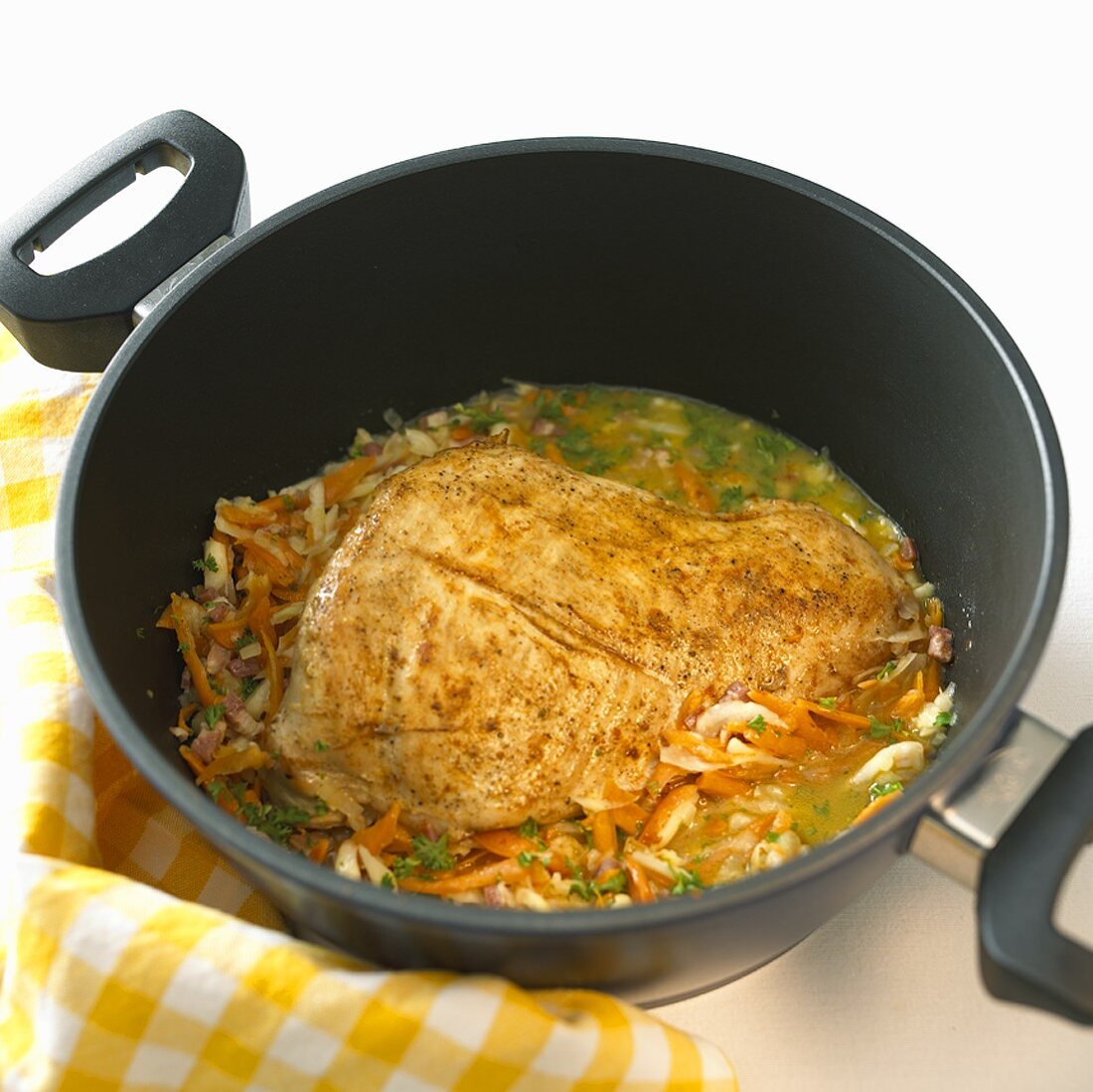 Roast turkey and vegetables in stew-pan
