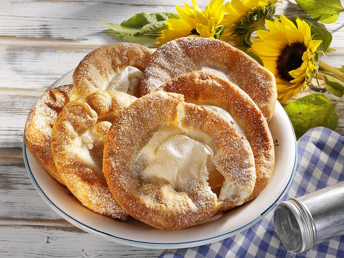 Auszogene (Bavarian doughnuts) on plate with sunflowers