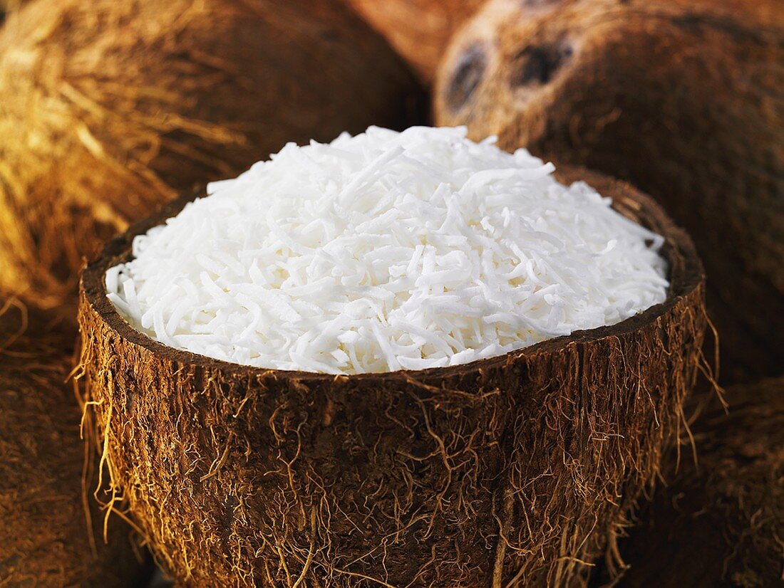 Grated coconut in half a coconut shell