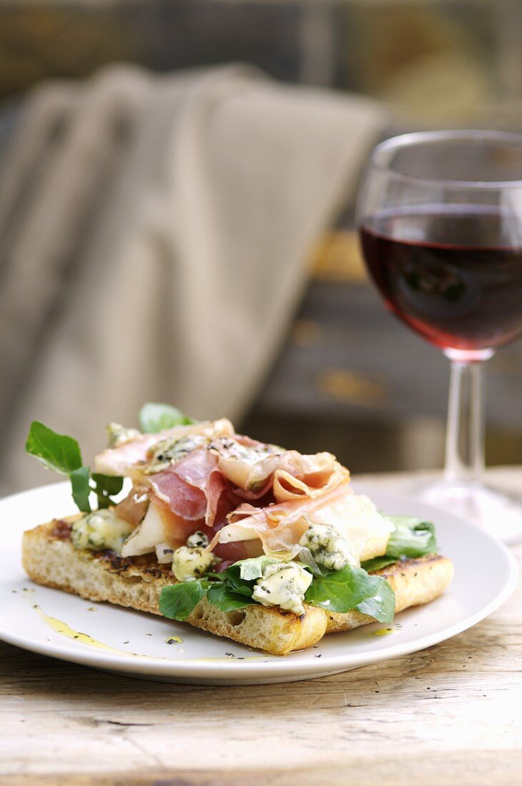 Toasted ciabatta topped with ham, Stilton and pears