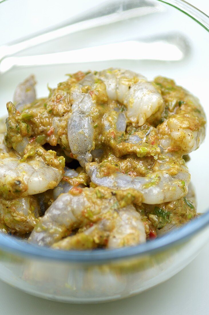 Marinated prawns in a glass bowl