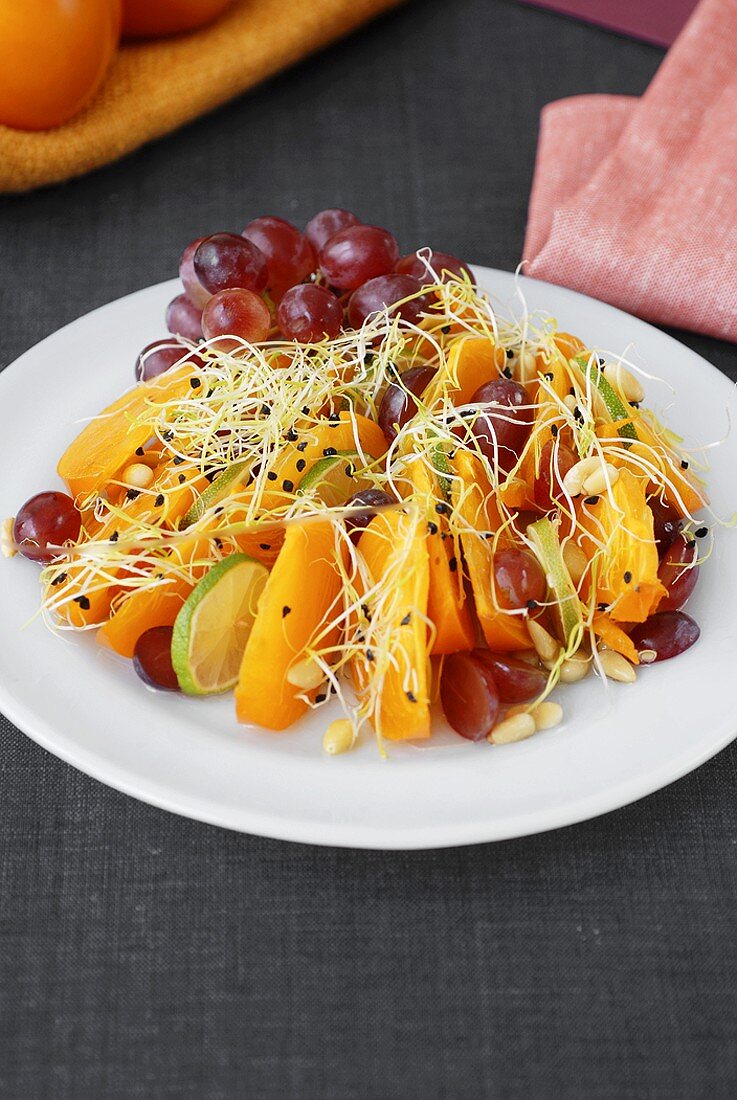 Sharon fruit and lime salad with red grapes