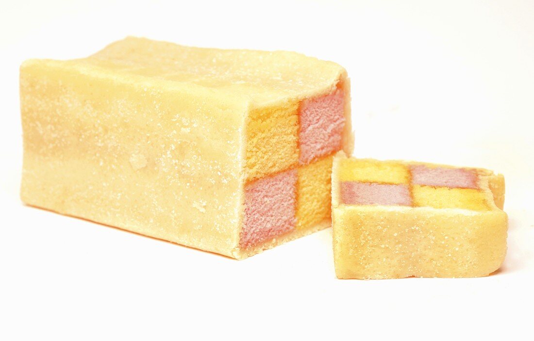 A Battenberg cake, a slice cut