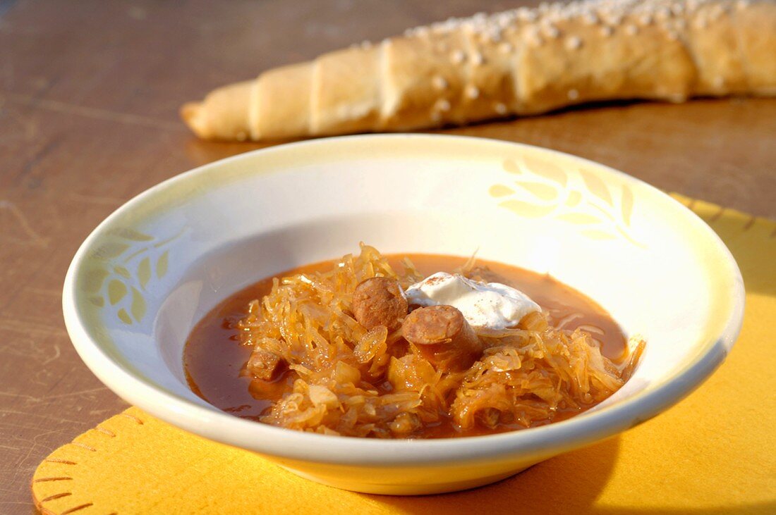 Cabbage soup with sausage and crème fraîche