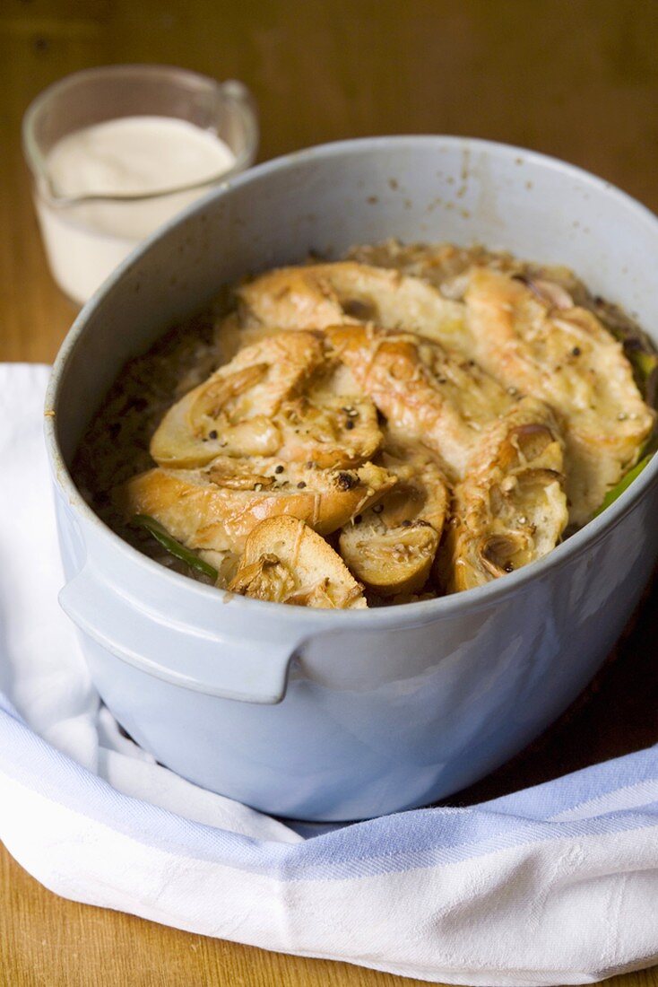 Onion soup with cheese croutes in pot