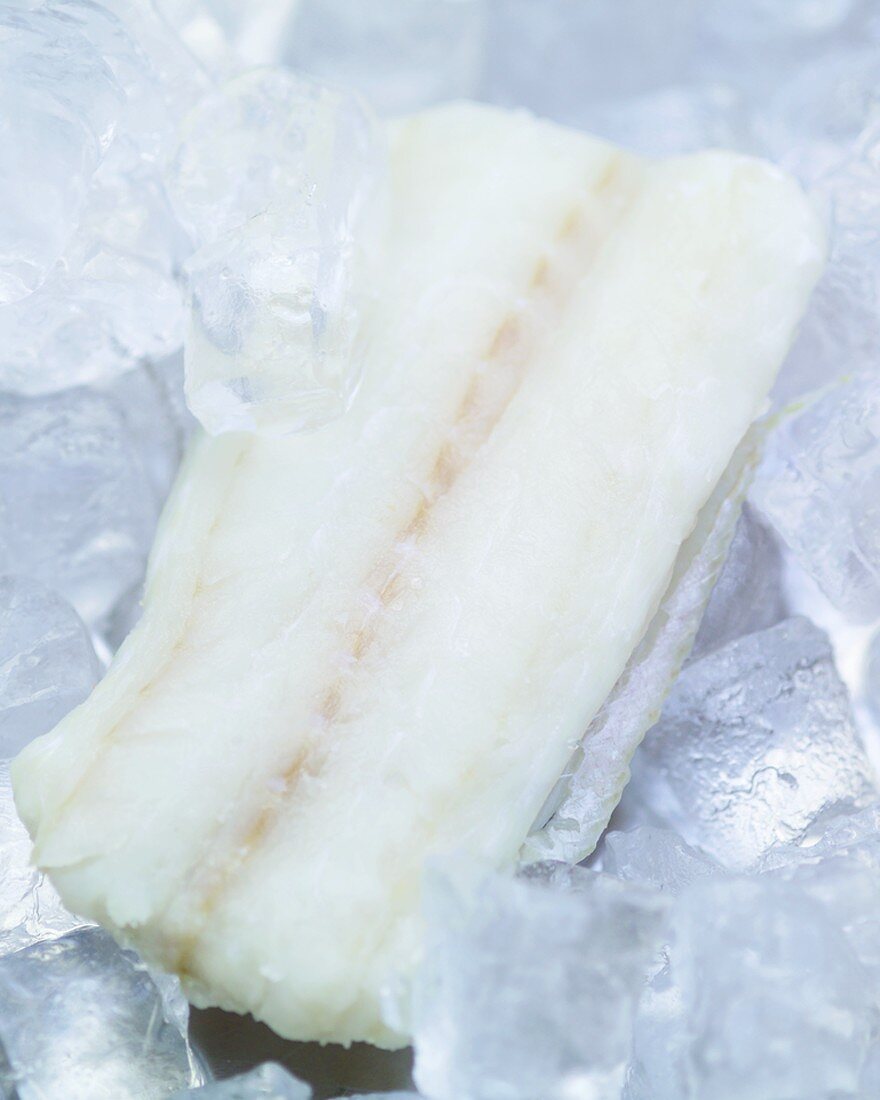 A fresh fish fillet on ice