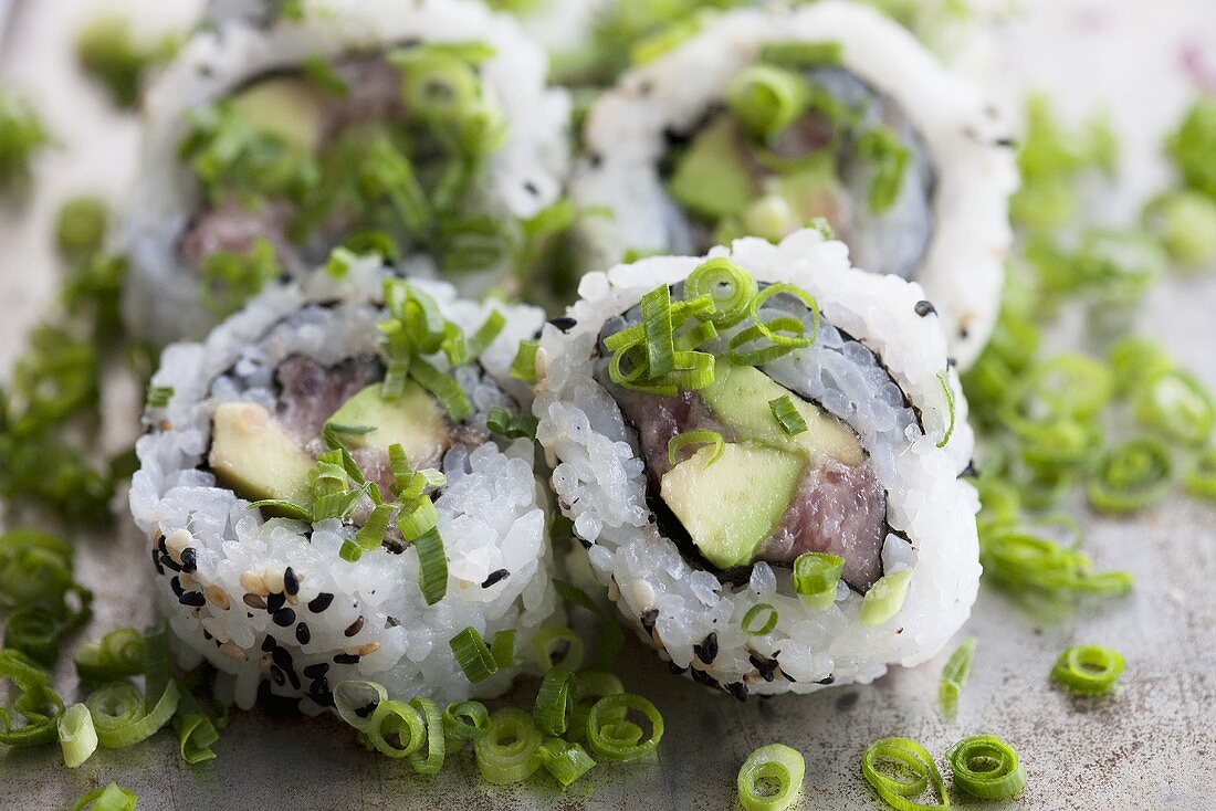 Inside-out sushi with asparagus, tuna and 'negi' (Japanese spring onions)