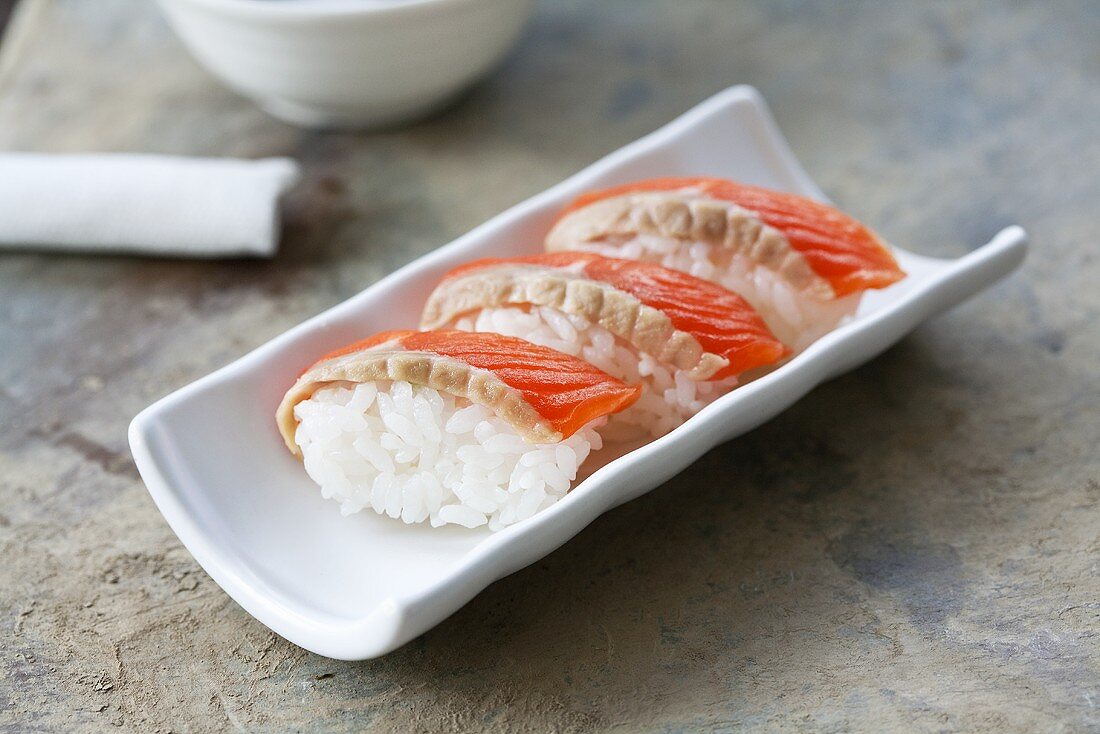 Three nigiri sushi with 'sake' (salmon), Japan