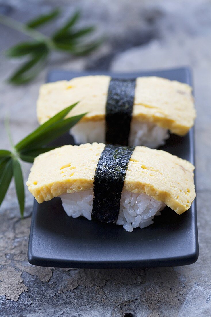 Tamago sushi (nigiri sushi with Japanese omlette)