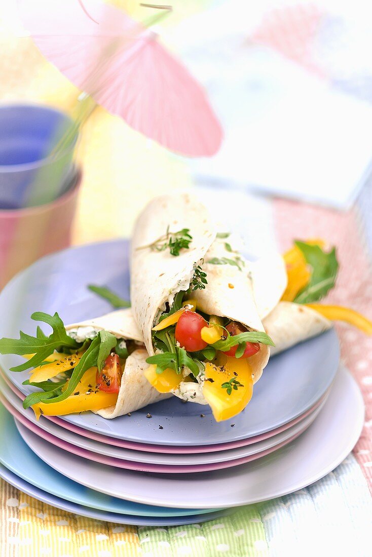 Goat's cheese wrap with cherry tomatoes, pepper and rocket