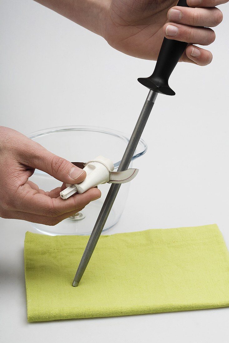 Sharpening the blade of a mixer