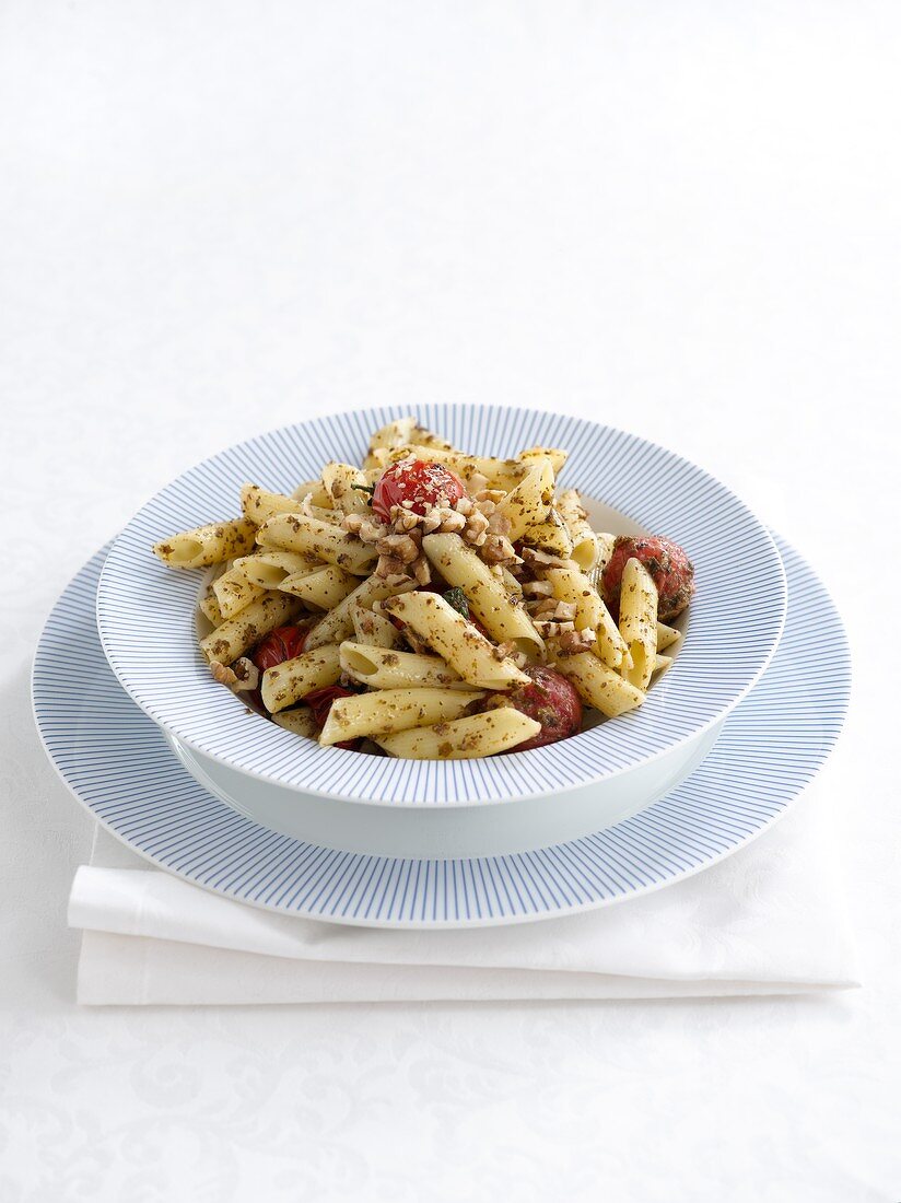Penne with pesto, tomatoes and walnuts