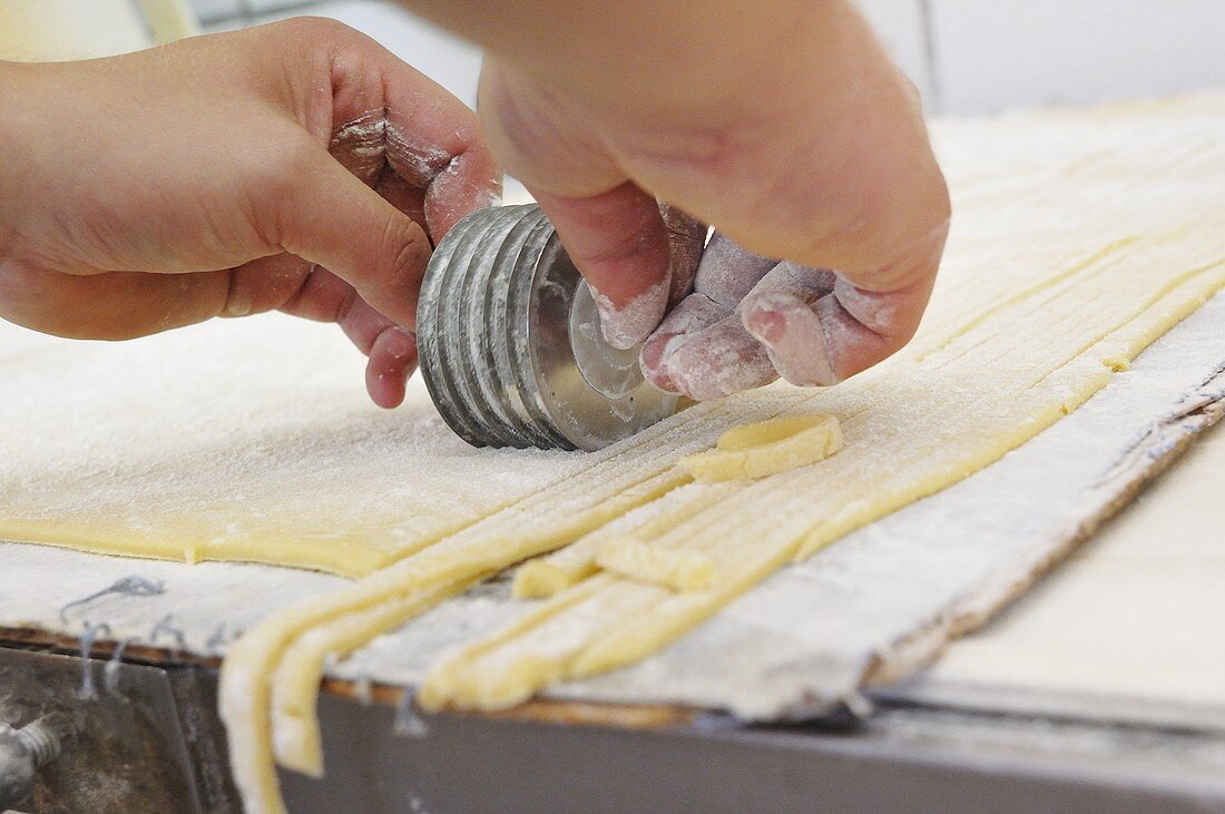 Cutting dough into strips
