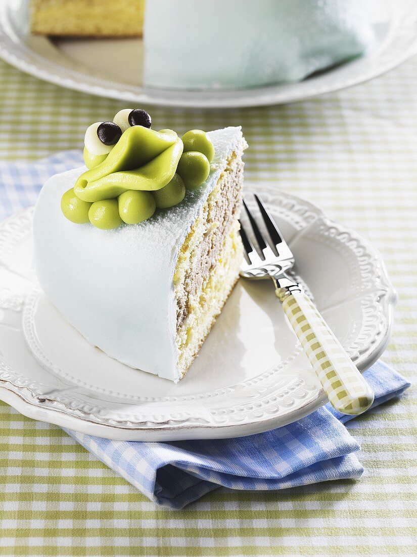 Prinsesstårta (princess cake) with a marzipan frog