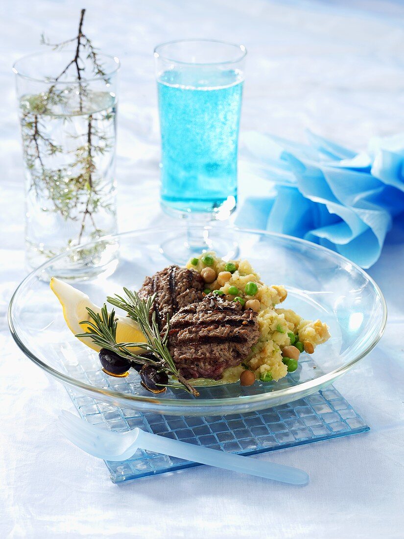 Grilled burgers with mashed potato and vegetables