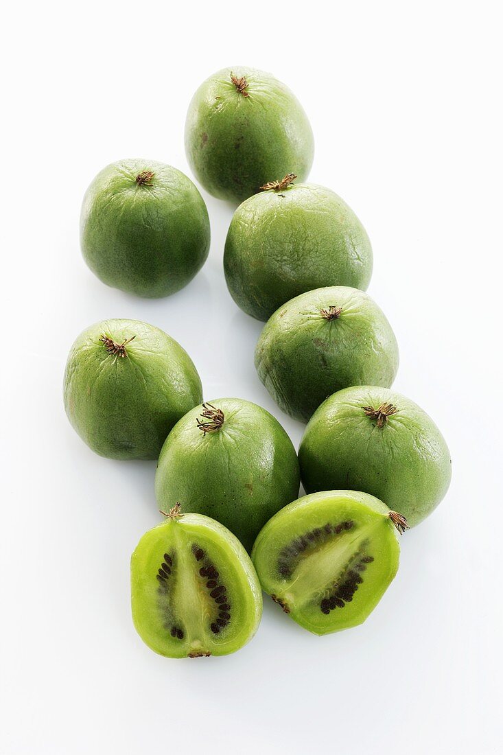 Baby kiwi fruits, one halved