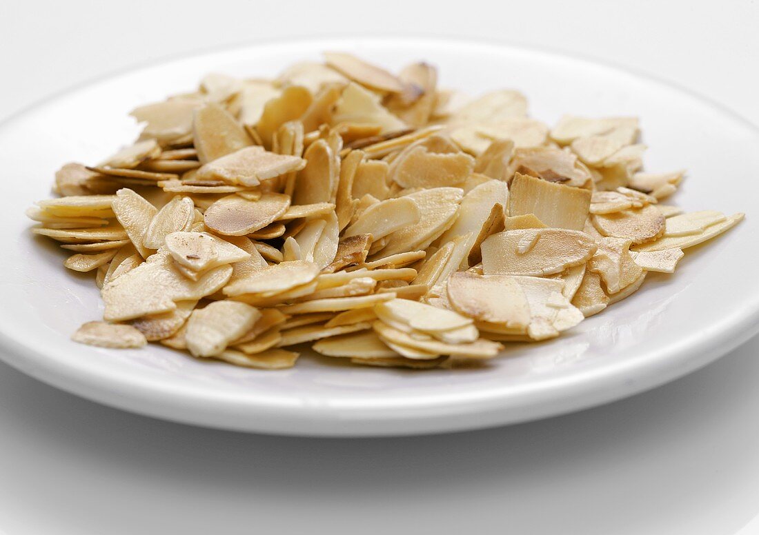 Toasted flaked almonds on a plate