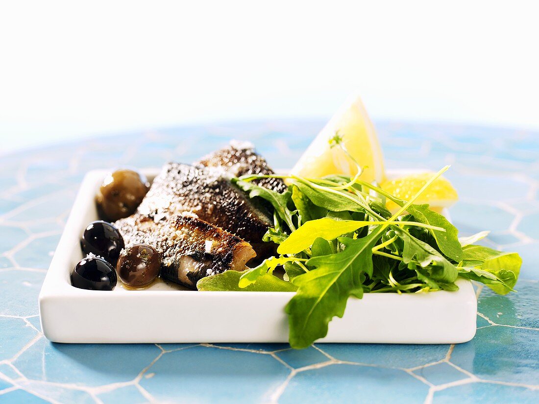 Salted herring with rocket and olives
