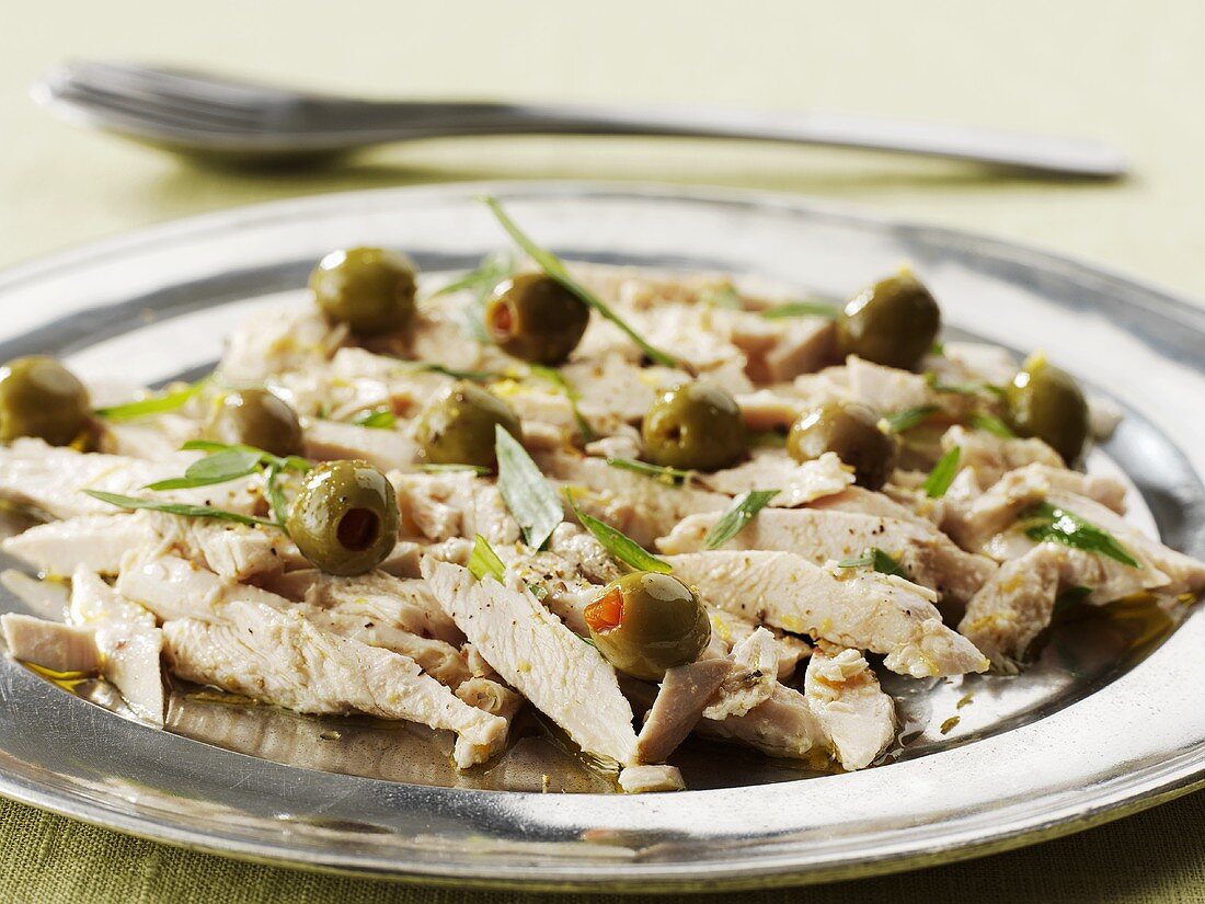 Marinated chicken breast with green olives