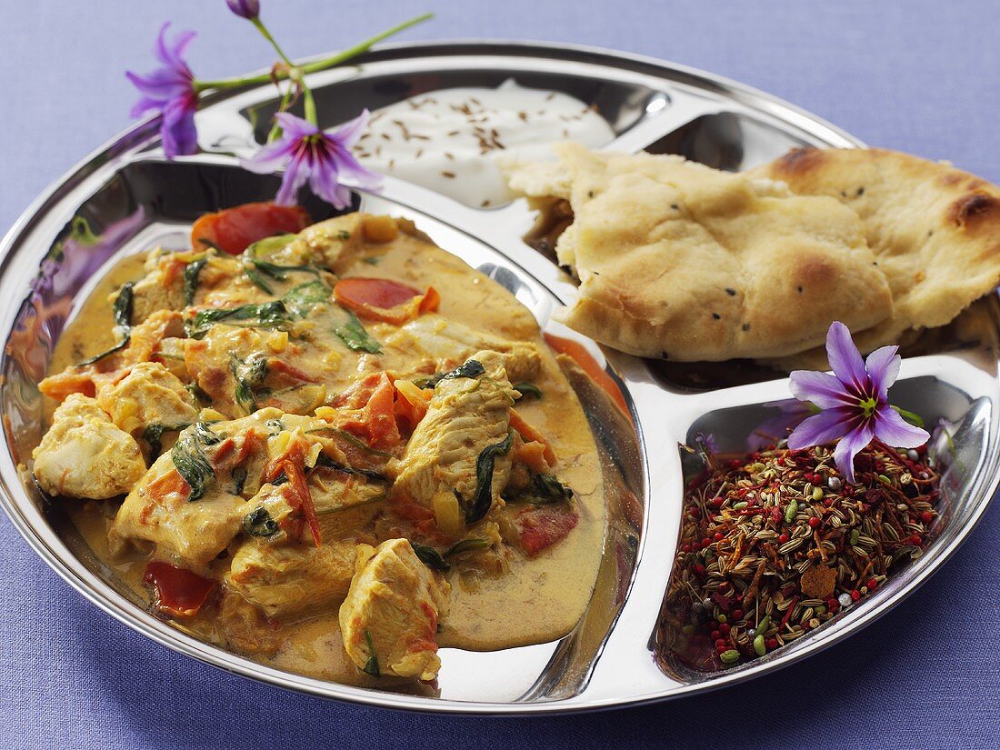 Chicken with tomatoes and spinach, flatbread