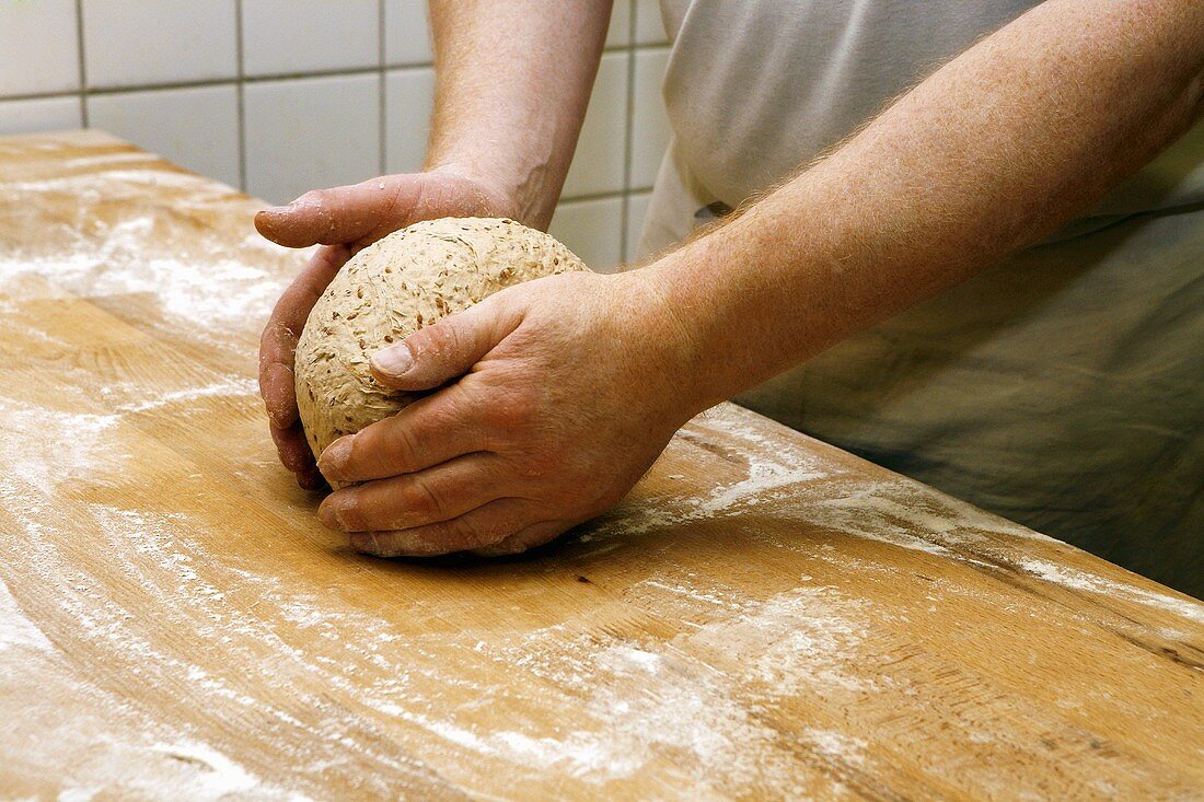 Shaping a loaf of bread