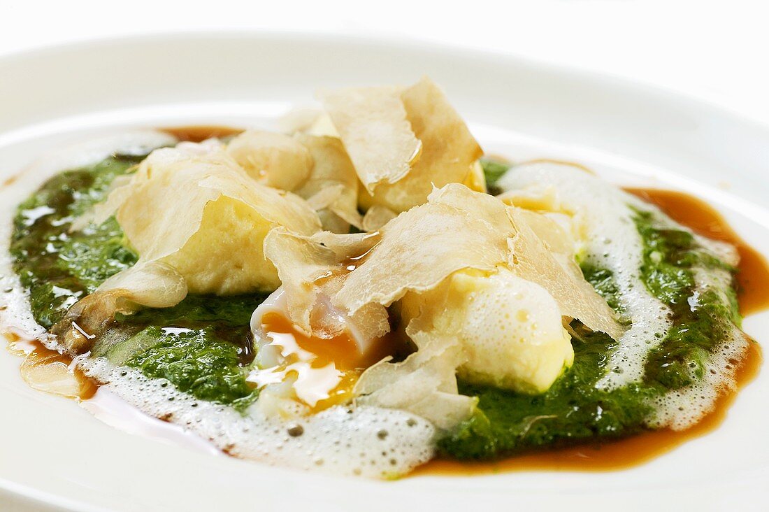 Ricotta dumplings on spinach with white truffle
