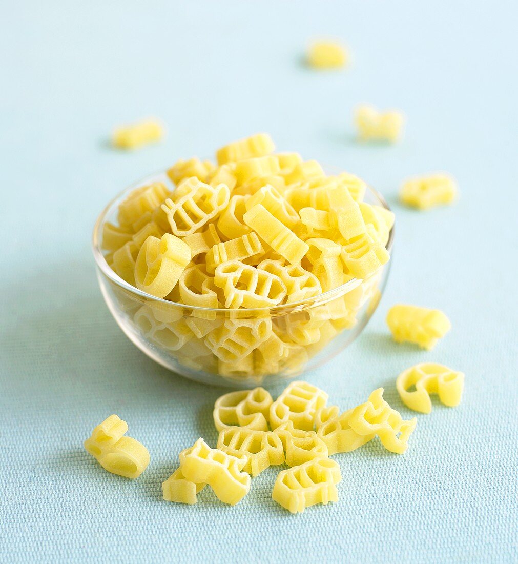 Animal shape pasta in a small glass bowl