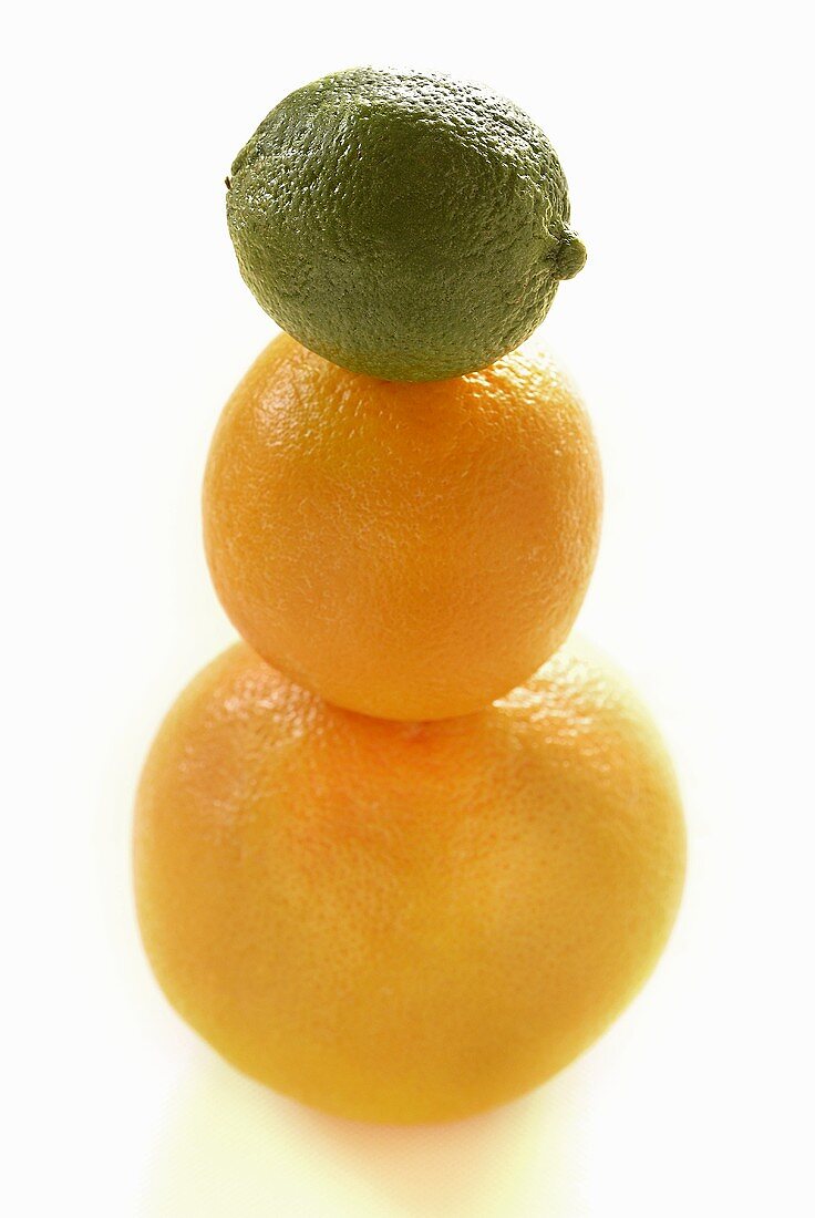 Three citrus fruits in a pile