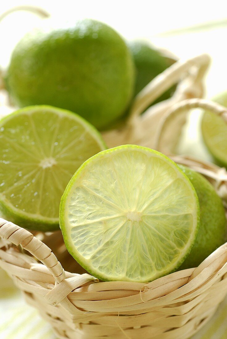 Half and whole limes in small baskets