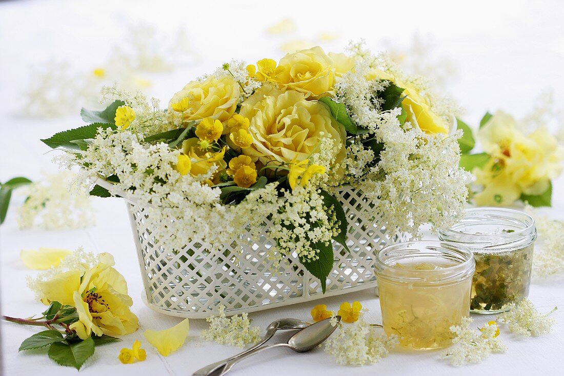 Table arrangement of perfumed roses and elderflowers