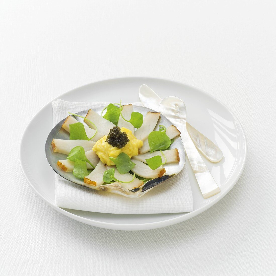 Smoked sturgeon with scrambled egg and caviar