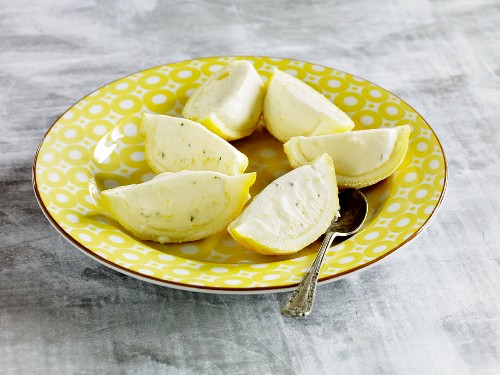 Lemon parfait served in lemon skins