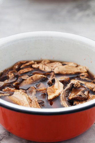 Dried mushrooms being soaked