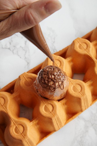 An Easter net being made from chocolate