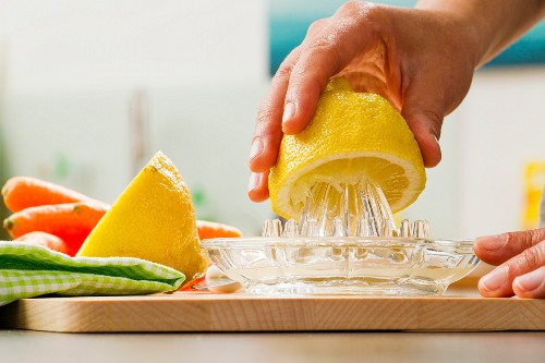 A lemon being pressed