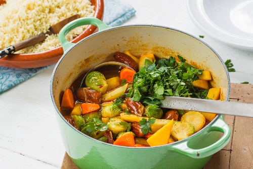 Vegan vegetable ragout with dates served with couscous