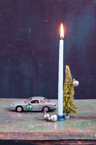 Toy cars as a candle holder as Christmas decoration