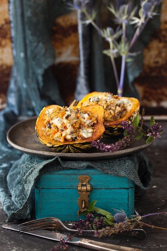 Baked acorn squash filled with chestnuts, mushrooms and quinoa