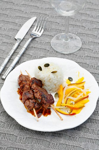 Lamb skewers with rice and mango salad