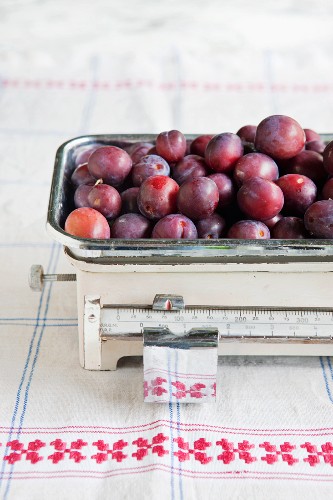 Plums on an old pair of kitchen scales