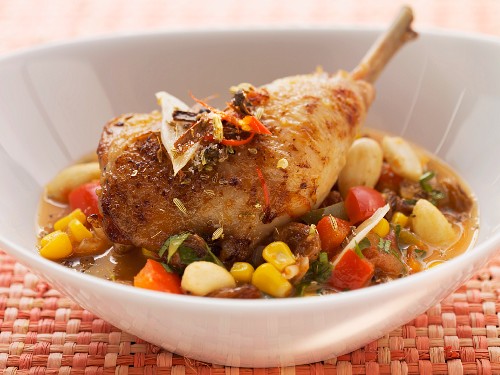 Roast chicken legs with tequila and vegetables