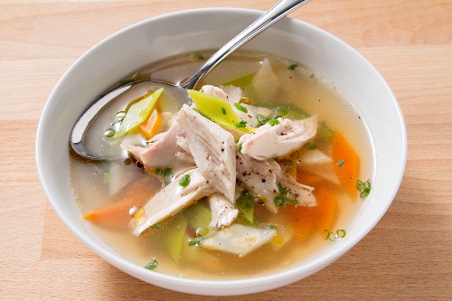 Clear soup with chicken and vegetables