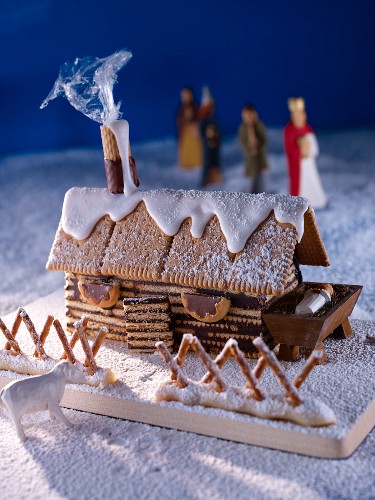 A winter scene with a gingerbread house