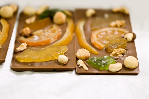 Bars of chocolate with candied fruits and nuts