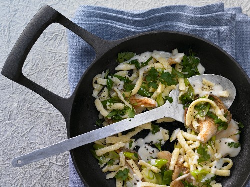 Pan-fried spätzle (soft egg noodles) with oyster mushrooms