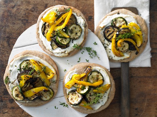 Mini spelt pizzas with antipasti vegetables and ricotta